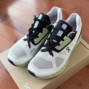 On Cloud Running Black, White, and Green Athletic Shoes